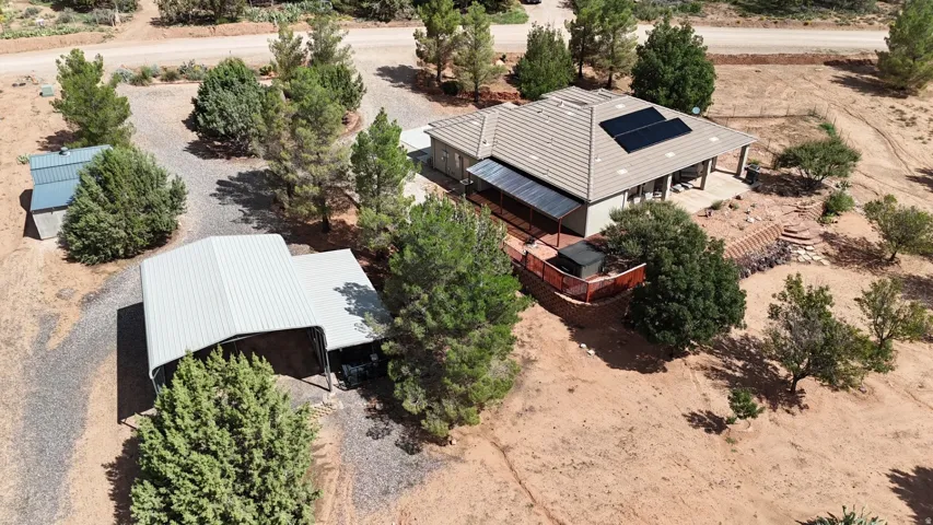 Single-story residence with a tiled roof and solar panels