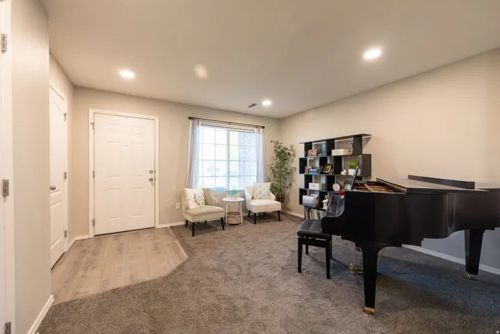 LVP entry to a flex room with a view of Mt Timpanogos. Formal living/music/study...