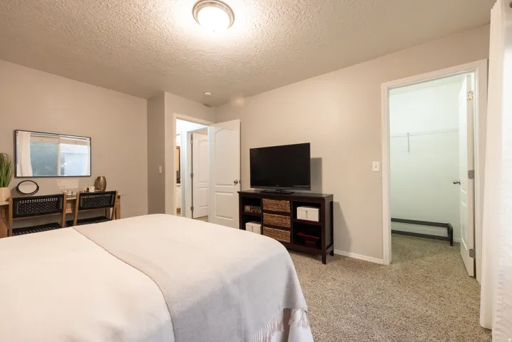 Upstairs bedroom 2 is spacious with a walk-in closet