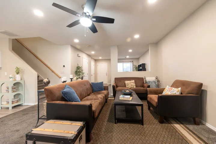 Family room adjacent to living room and dining and kitchen makes for an open, inviting floormplan. Recessed lighting, ceiling fan, newer carpet