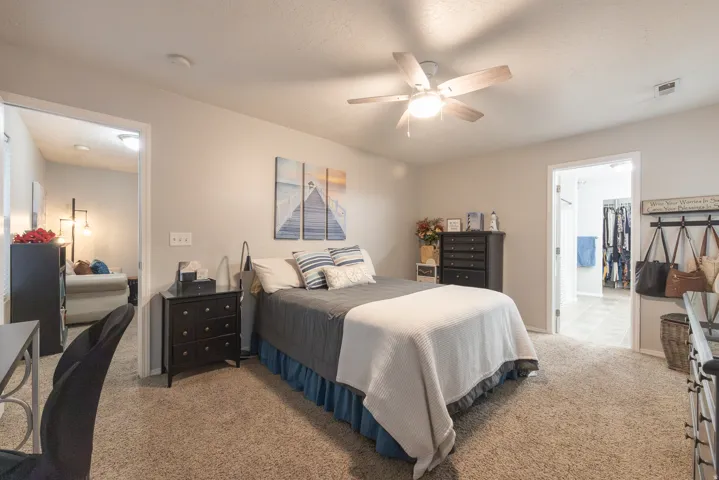 Primary suite bedroom adjacent to upstairs loft/nook