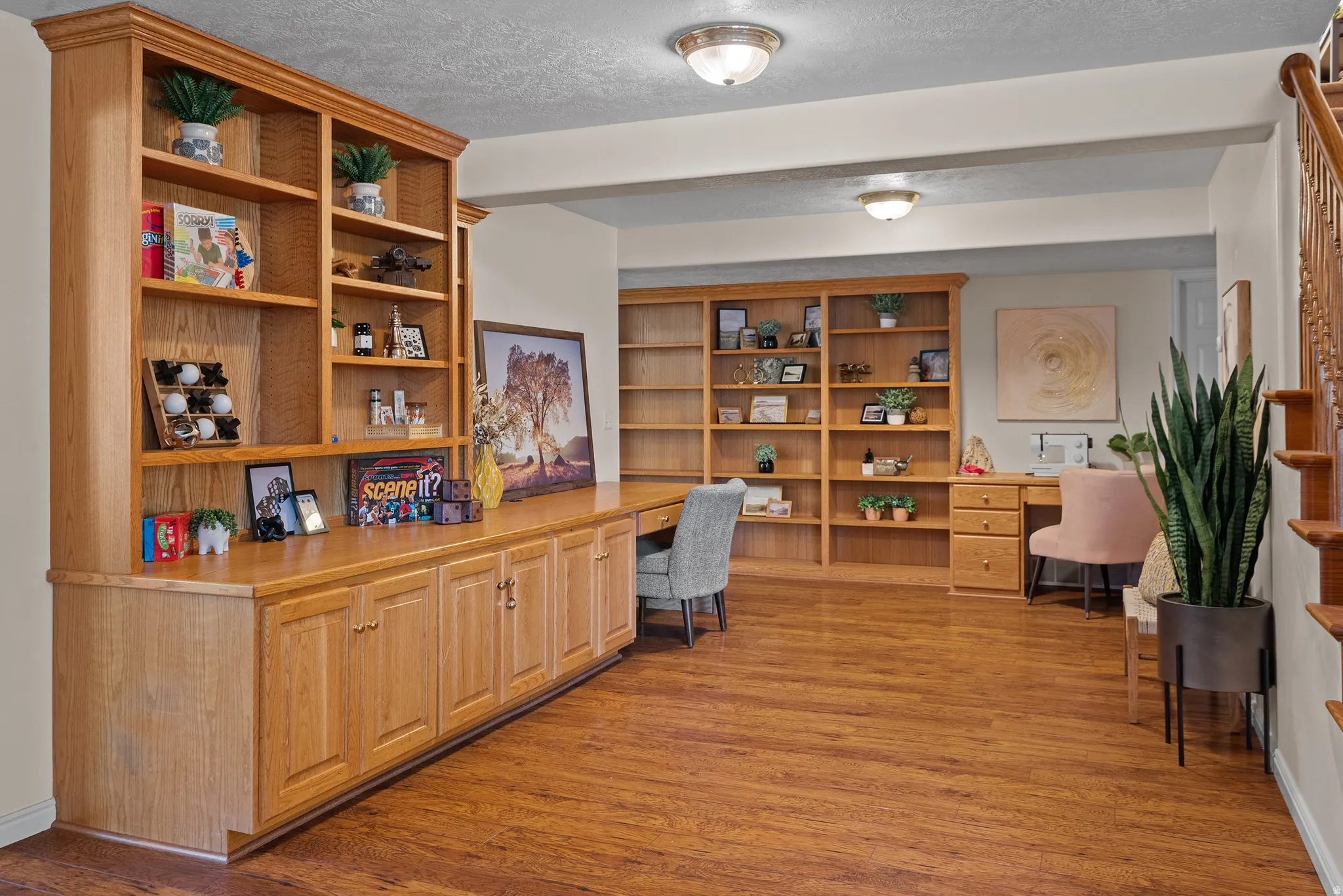 Wood-finish flooring with extensive built-in cabinetry and shelving