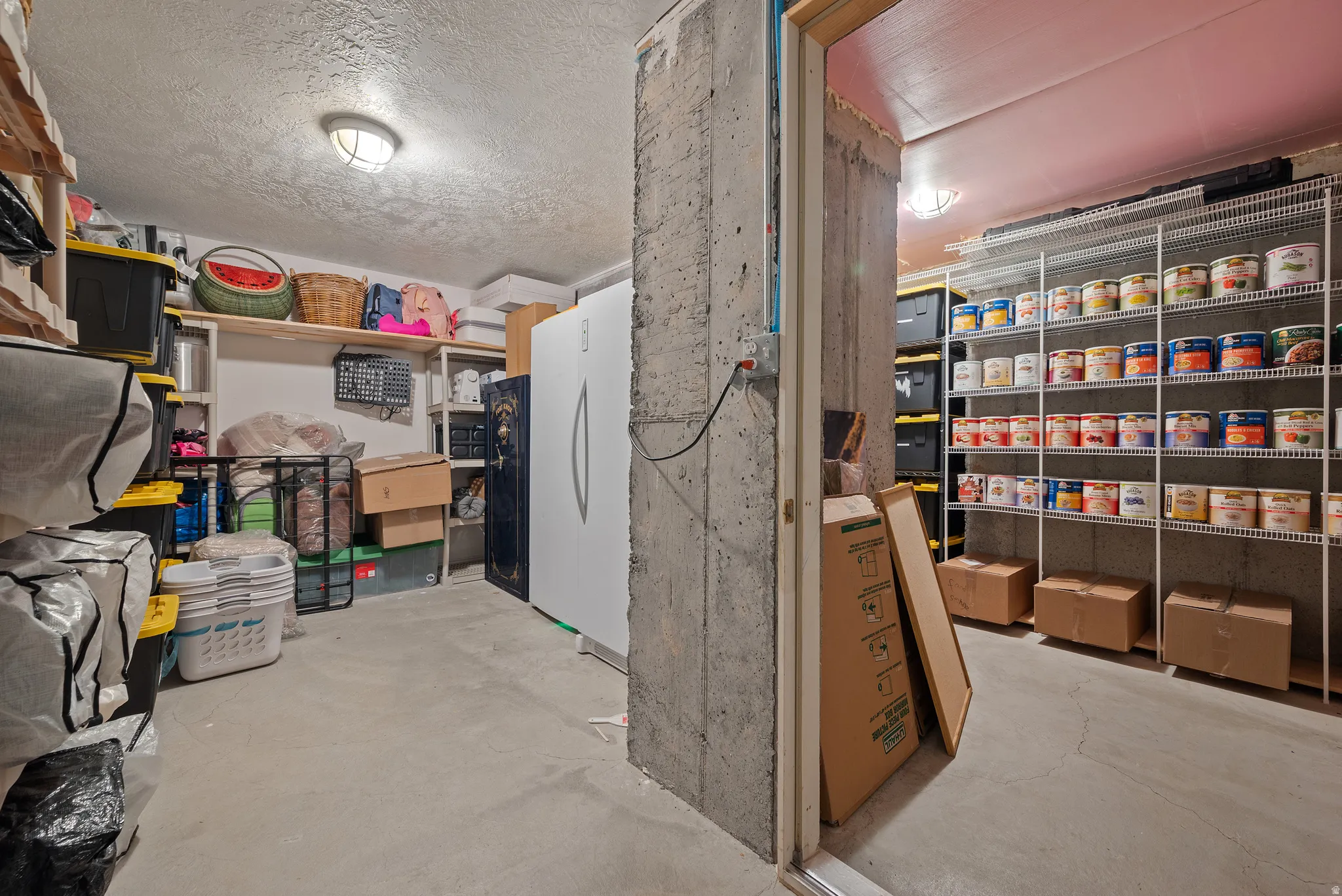 Concrete flooring and walls featuring built-in wire shelving