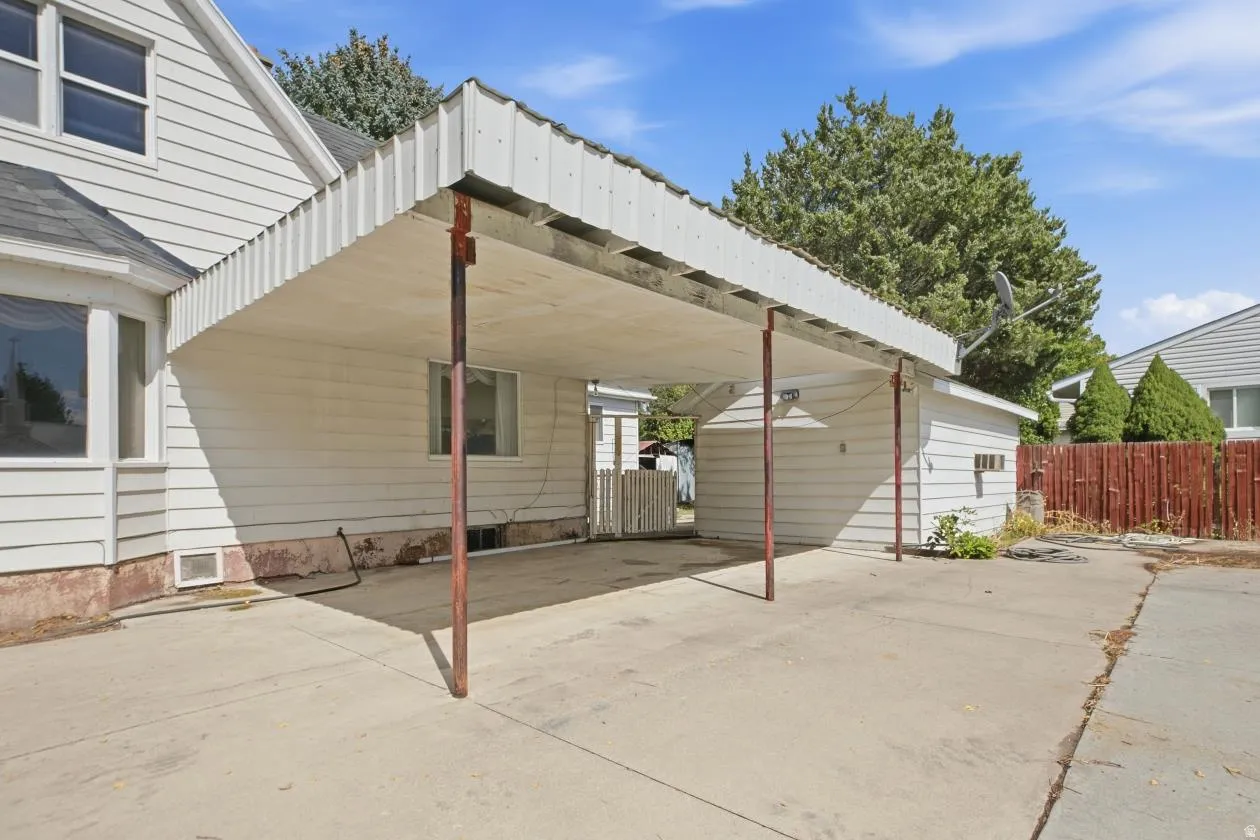 Covered carport with a concrete surface