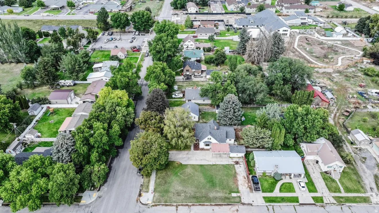 Residential neighborhood with mature trees, established street grid, and diverse architectural styles