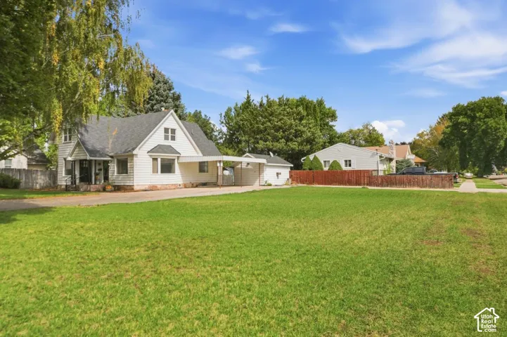 White clapboard exterior with an attached carport