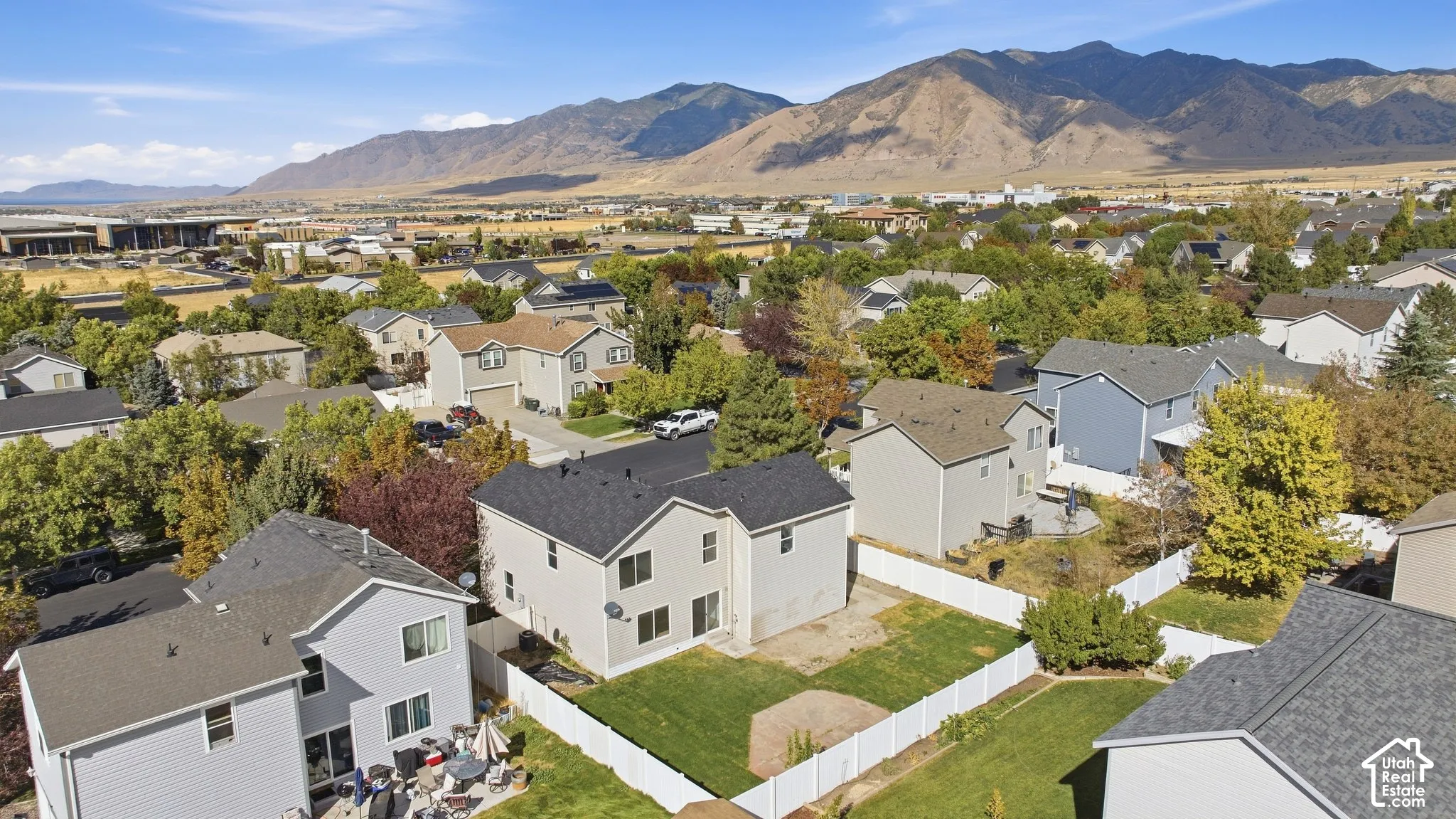 Two-story residence with a fenced backyard