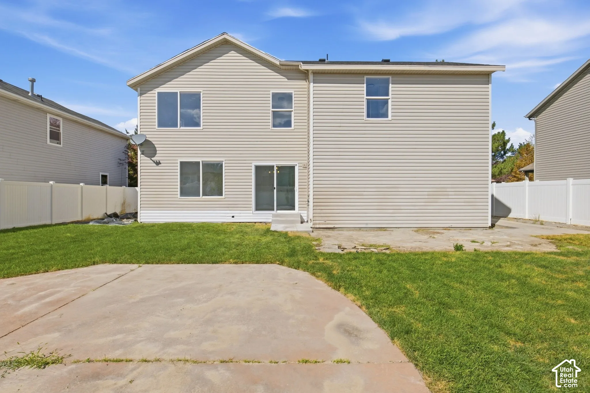 Two-story exterior with light-toned horizontal siding