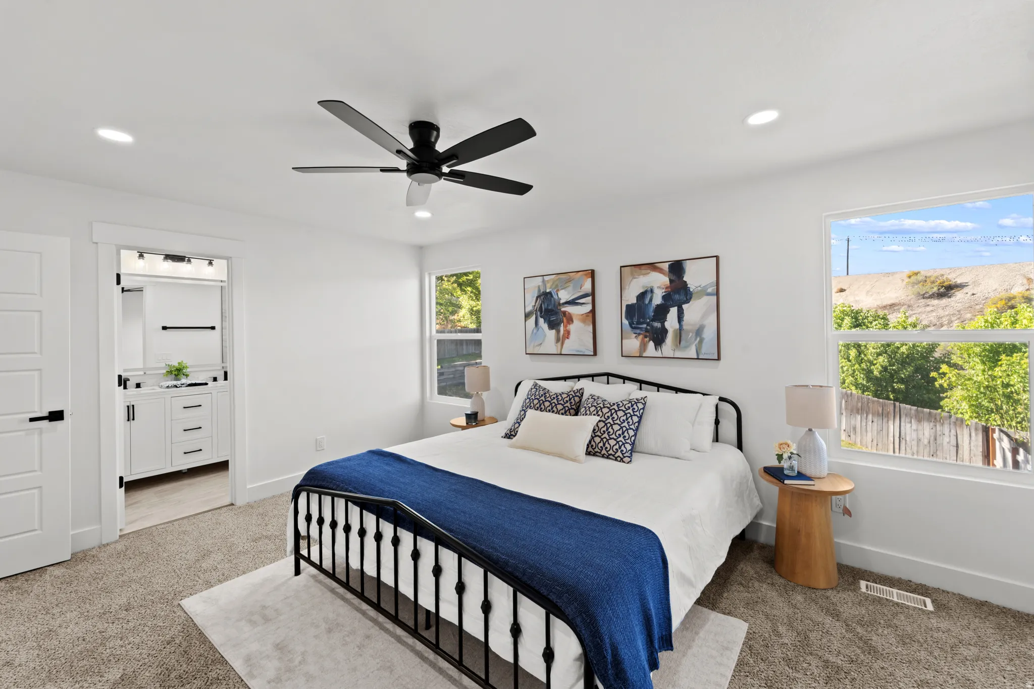 Recessed lighting, ceiling fan, and carpet flooring
