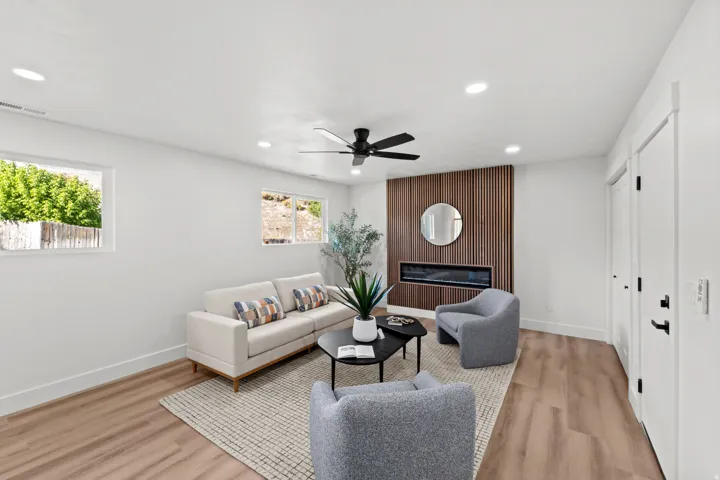 Recessed lighting, wood-finish flooring, and a modern ceiling fan