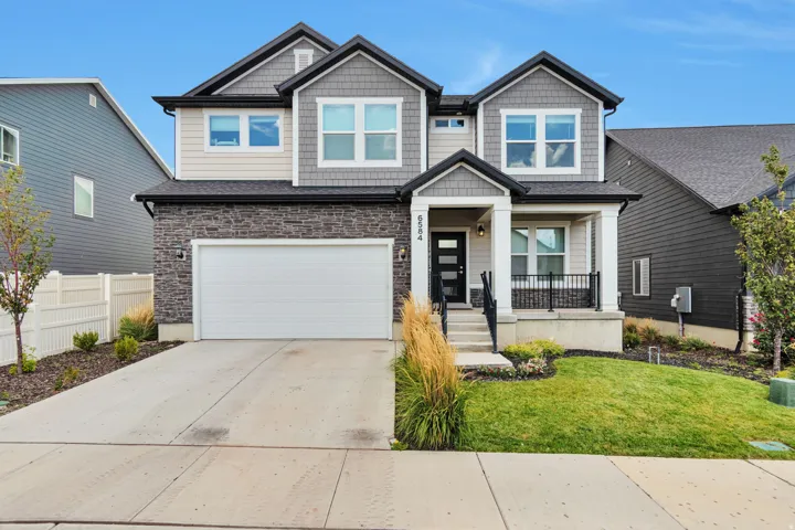 Contemporary two-story exterior with stone and siding facade