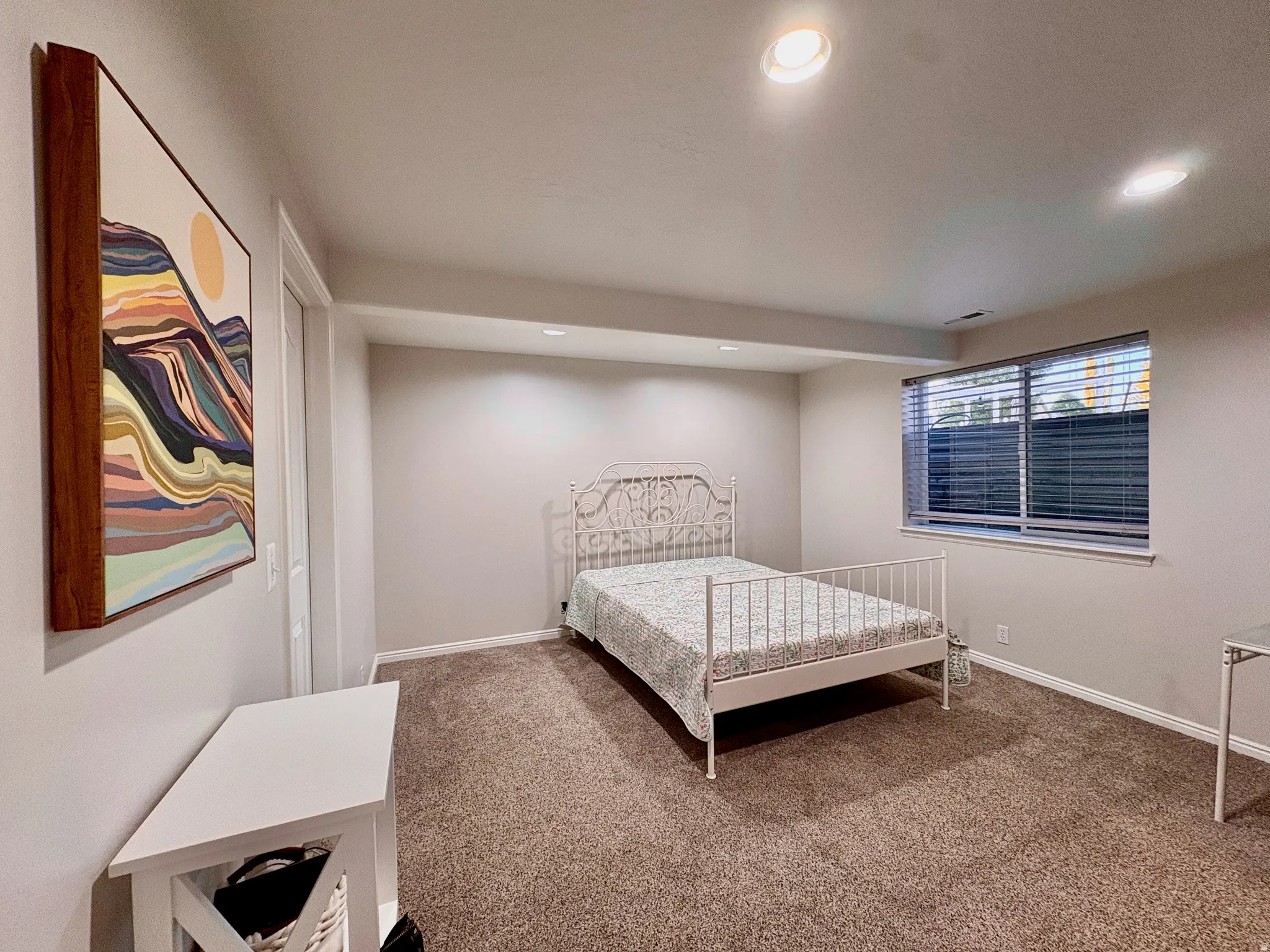 Recessed lighting, window with blinds, and carpeted flooring