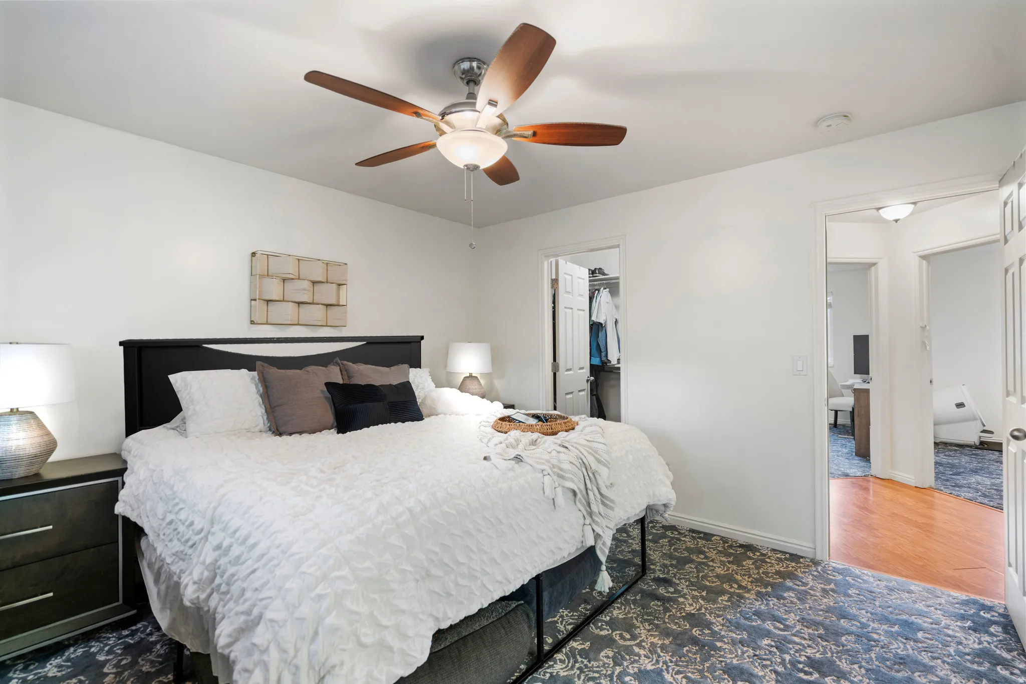 Wood-finish ceiling fan with integrated lighting, recessed lighting, and a built-in closet