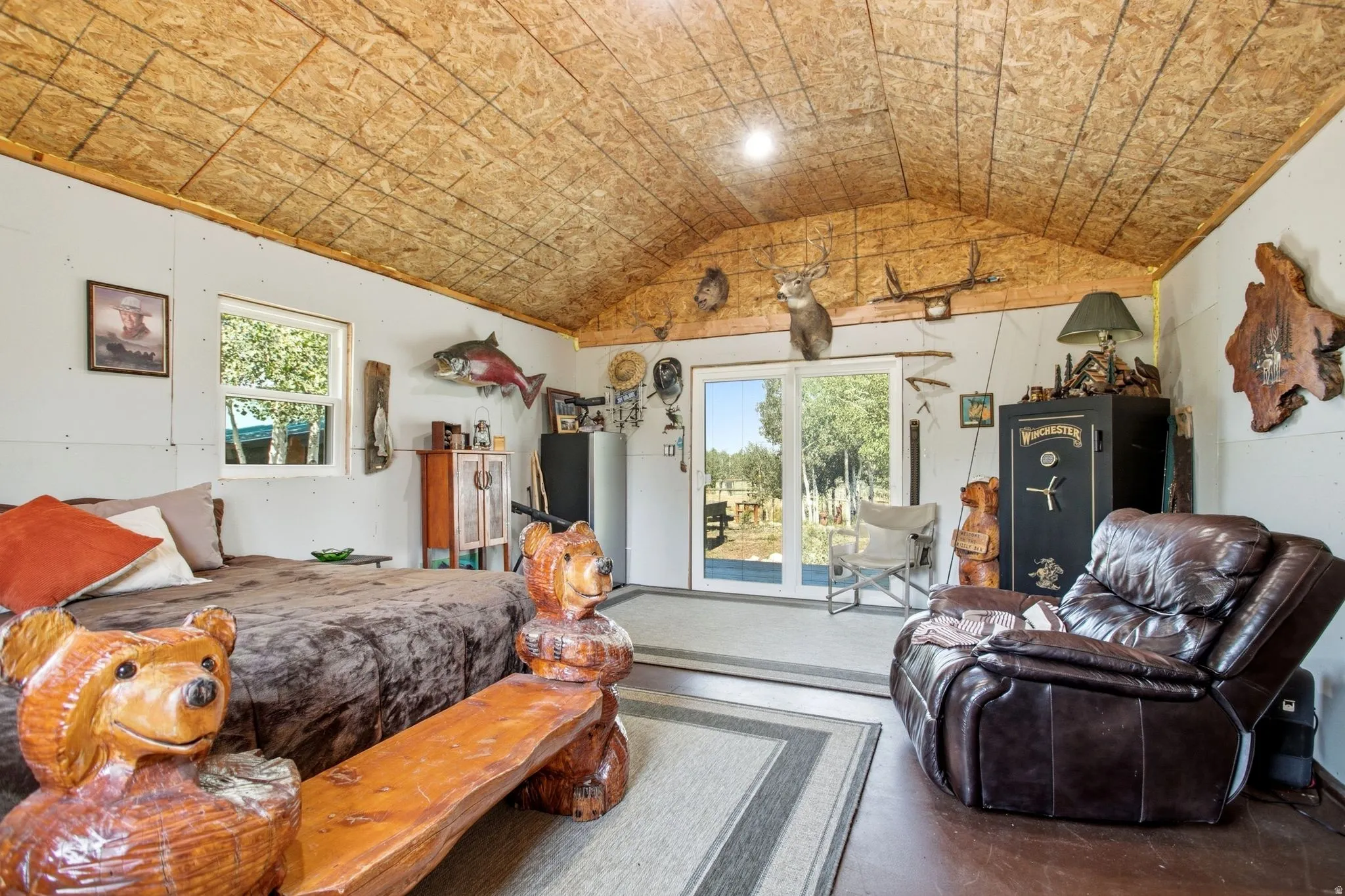 Bunkhouse- Vaulted wood-finish ceiling, white walls, and wood-finish flooring