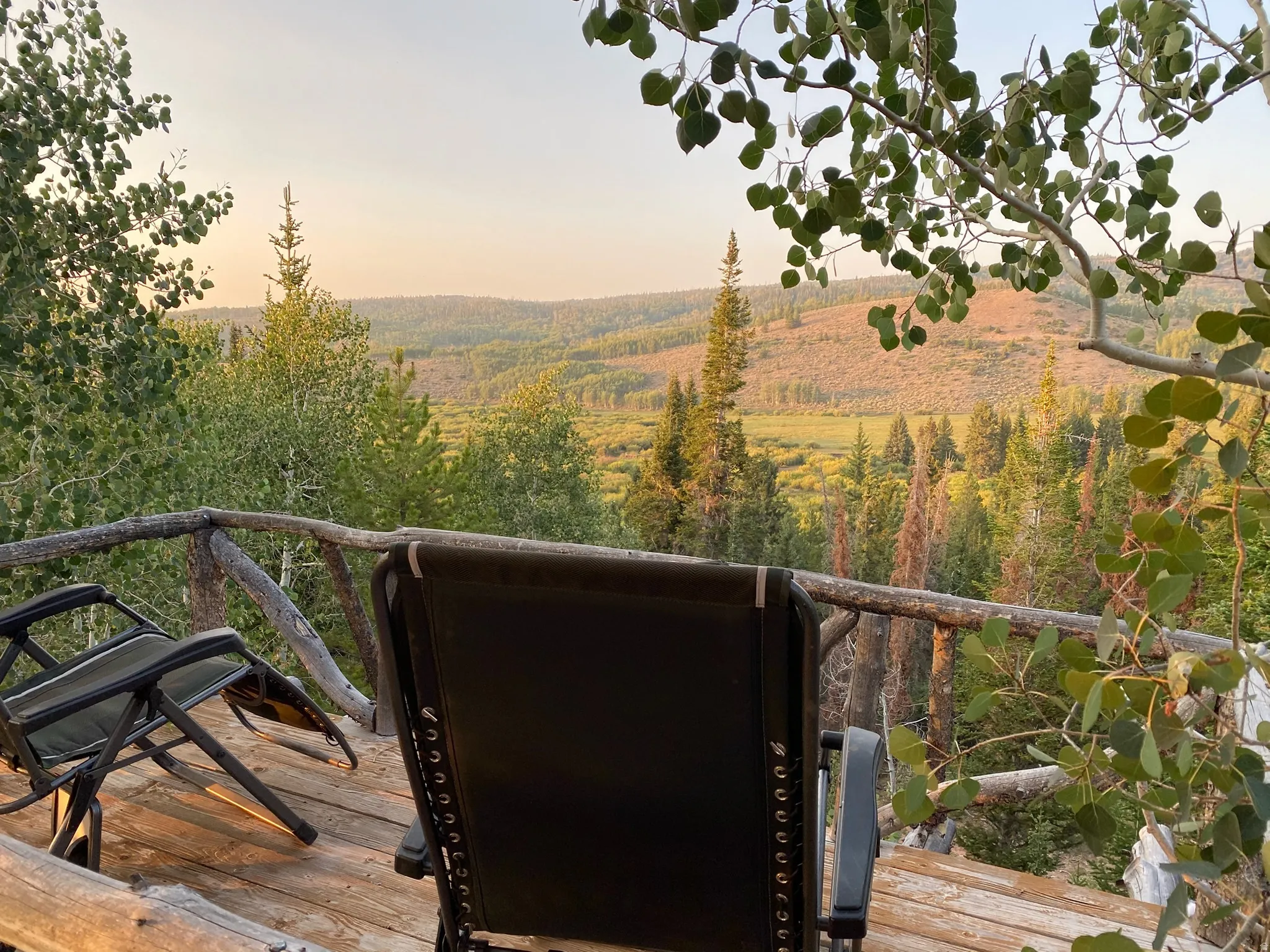 Wood plank decking with a rustic wood railing