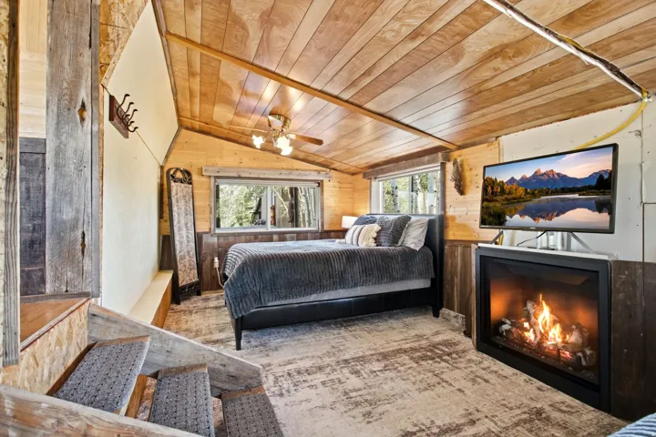 Wood-paneled ceiling with a central ceiling fan light fixture