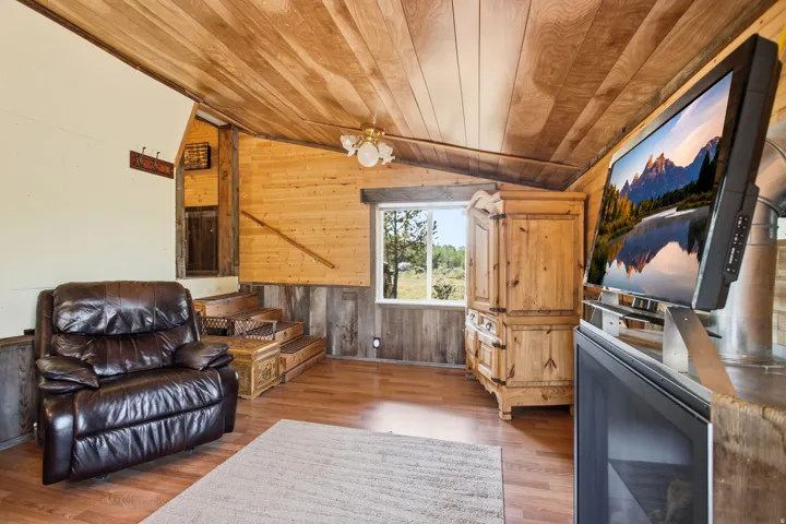 Wood-finish flooring with wood plank ceiling and walls