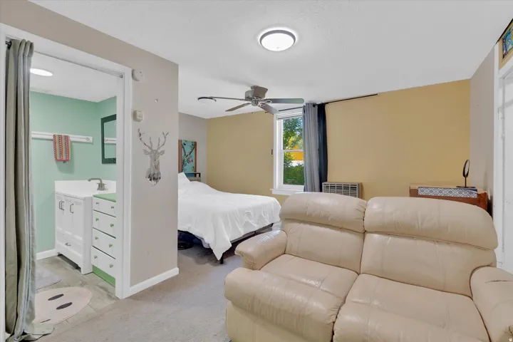 Primary bedroom with 3/4 bath and sitting area