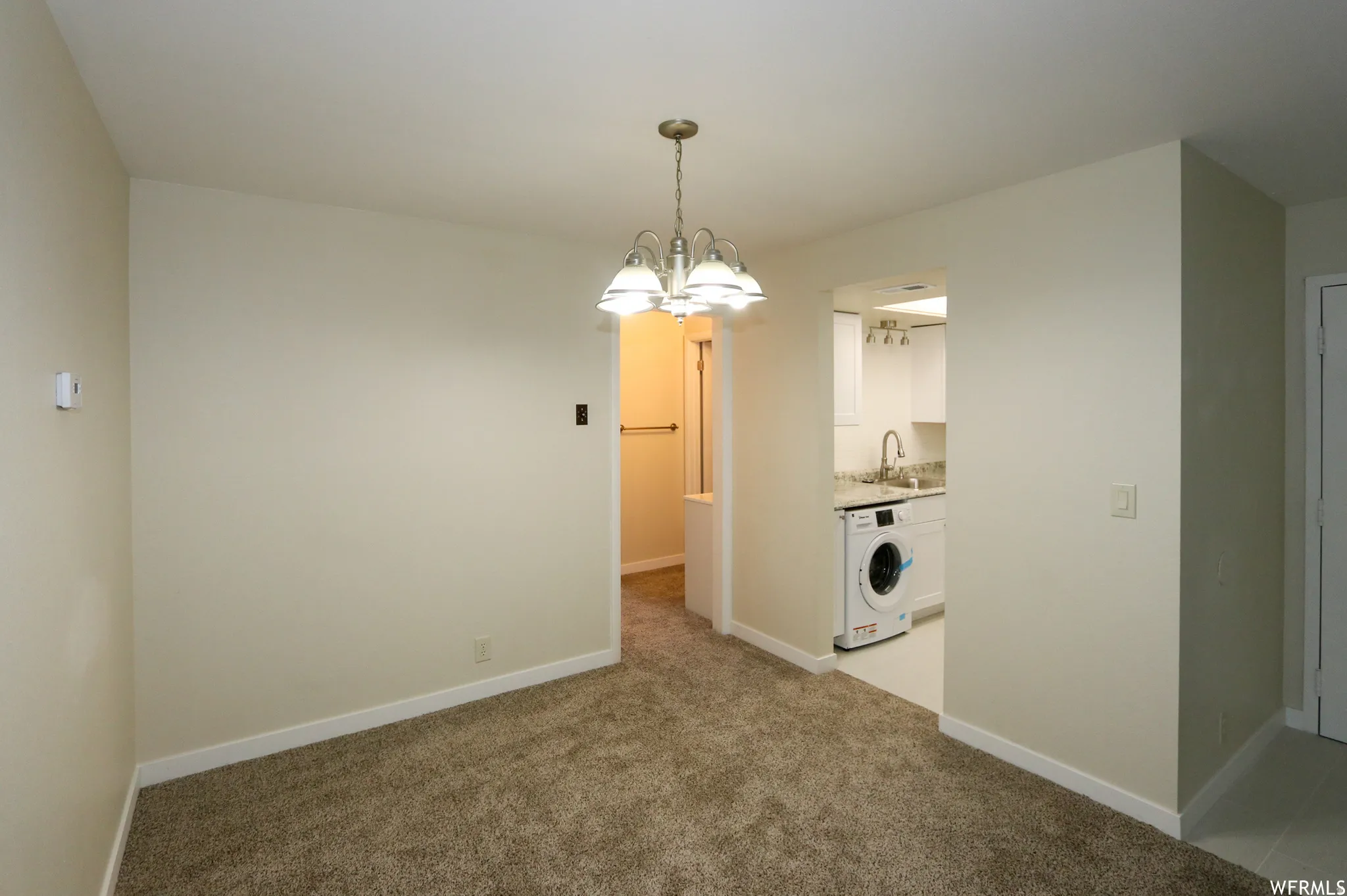 Textured carpet flooring with white baseboards