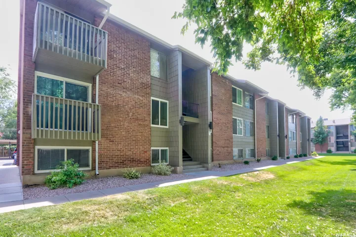 Multi-story building featuring brick and horizontal siding