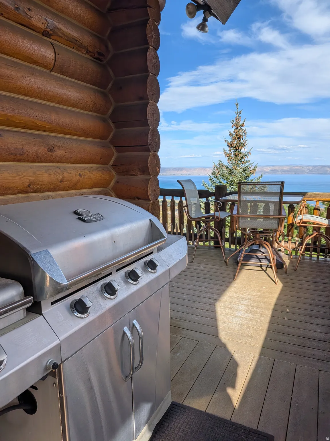 Expansive outdoor deck with wood planking and protective railing