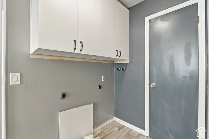 White upper cabinetry with black hardware