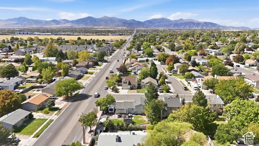 Residential neighborhood with established landscaping and mountain backdrop