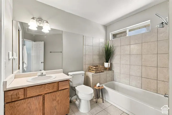 Wood-finish vanity with an integrated sink and chrome faucet