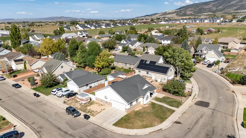 Residential neighborhood featuring detached single-family homes, paved streets, and established landscaping