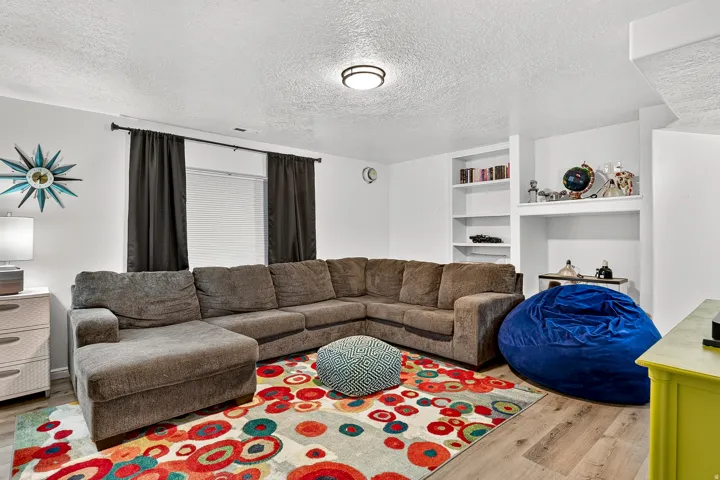 Built-in shelving, recessed alcove, and wood-finish flooring