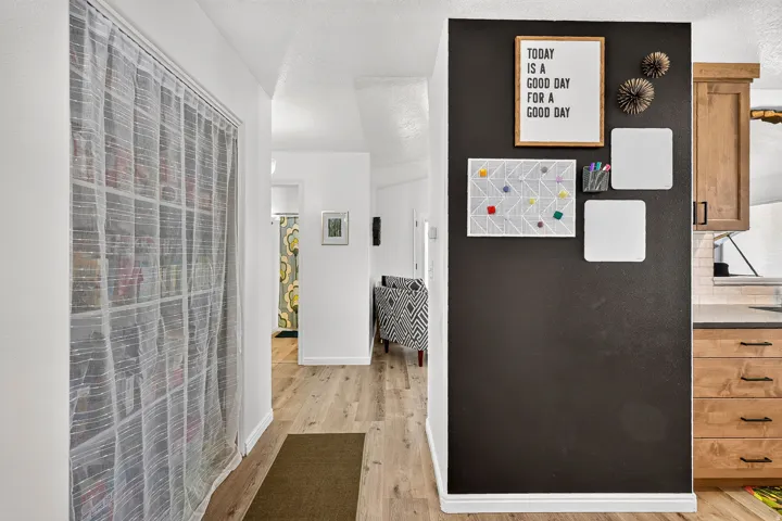 Wood-finish flooring extending through the hallway