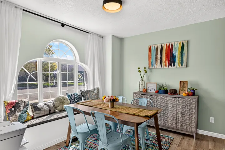Arched window with gridded panes and integrated window seating