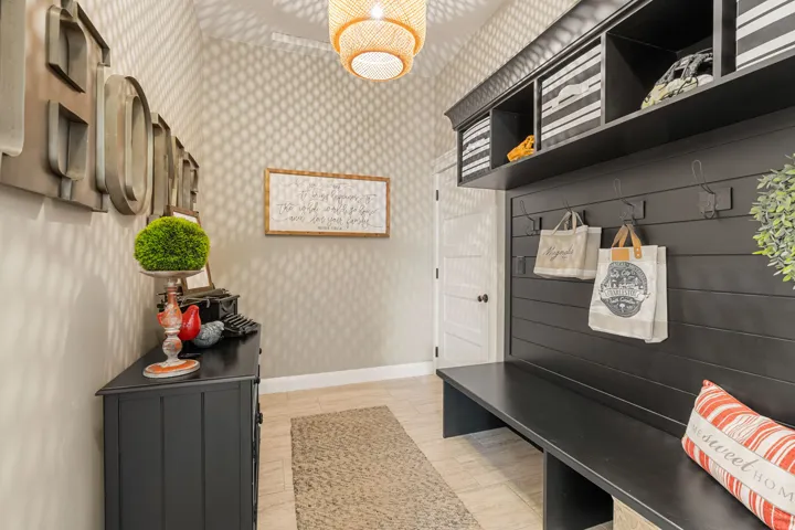 Custom-built mudroom bench with integrated shelving and wall hooks