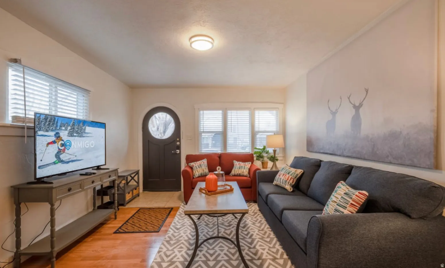 Hardwood-style flooring complemented by light-toned walls