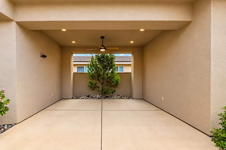 Covered patio with recessed lighting, ceiling fan, and concrete flooring
