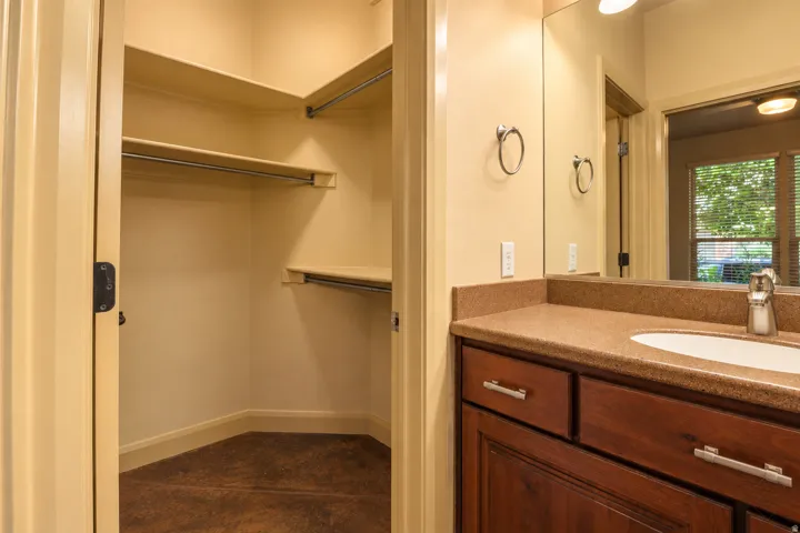 Walk-in closet with integrated shelving and hanging rods