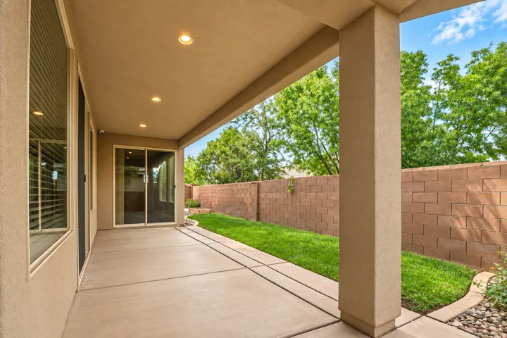 Covered patio with recessed lighting, concrete flooring, and sliding glass door access