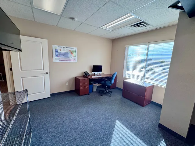 Unit A- Recessed lighting, drop ceiling, and wall-mounted television