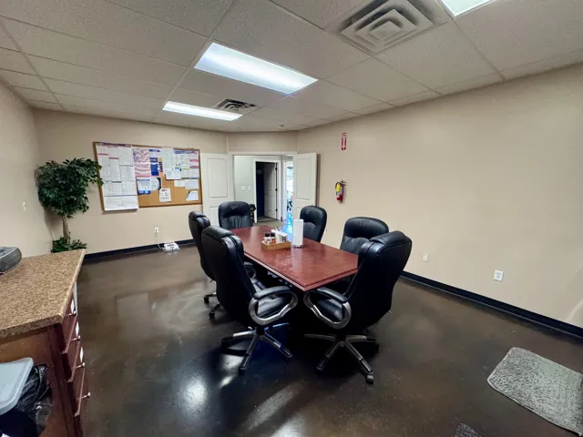Unit A- Breakroom and kitchen, Commercial interior with hard surface flooring, drop ceiling, and recessed lighting