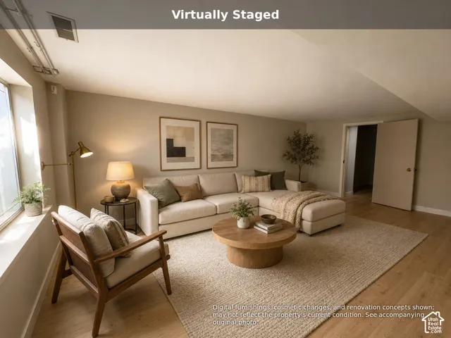 Neutral-toned interior featuring wood-finish flooring, a deep-set window, and a solid-core interior door