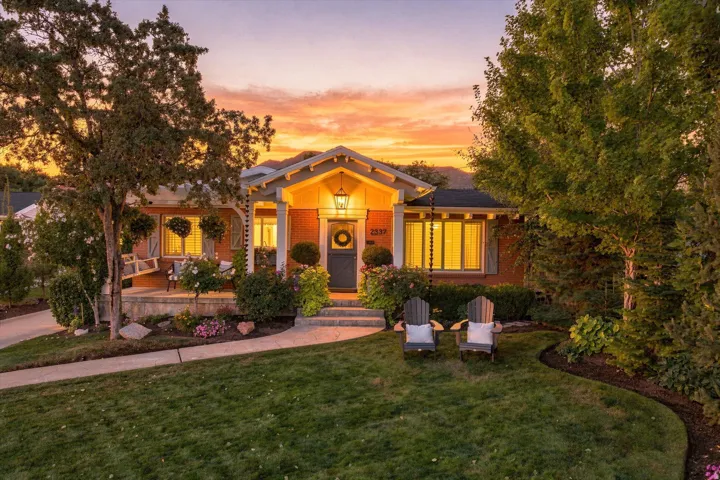 Brick exterior with a covered front porch and a prominent entry