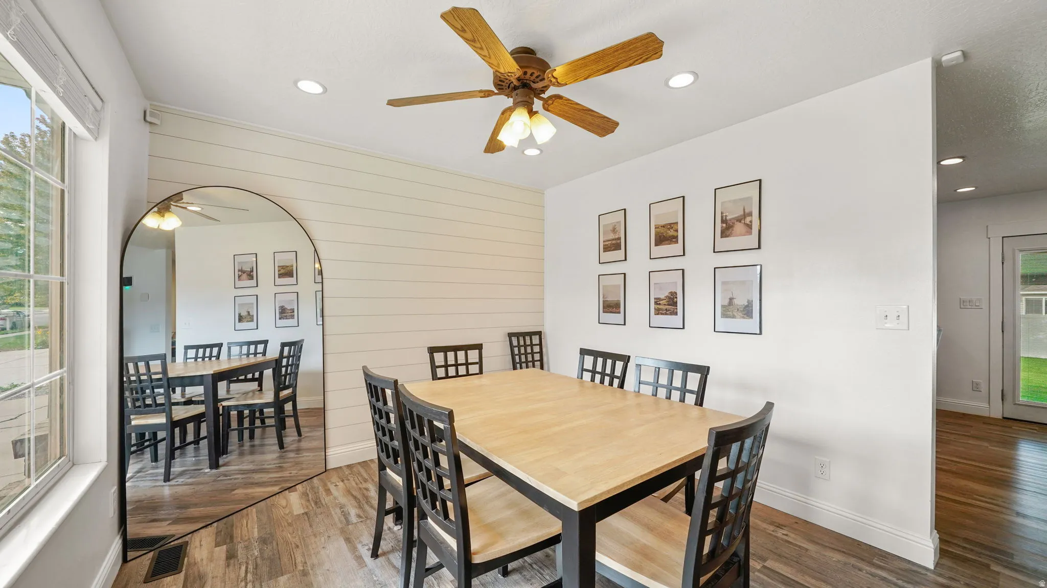 Wood-finish flooring, recessed lighting, and a ceiling fan with light fixture