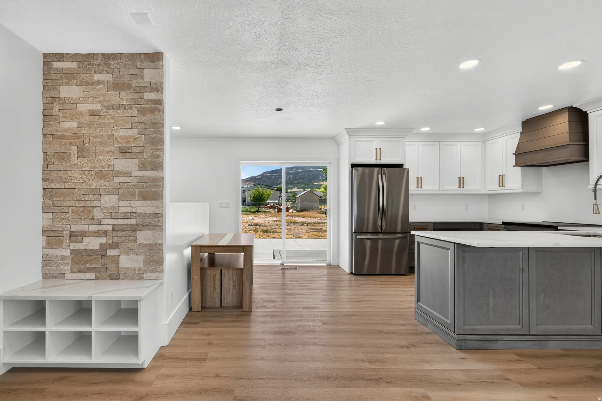 Wood-finish flooring throughout the open concept space