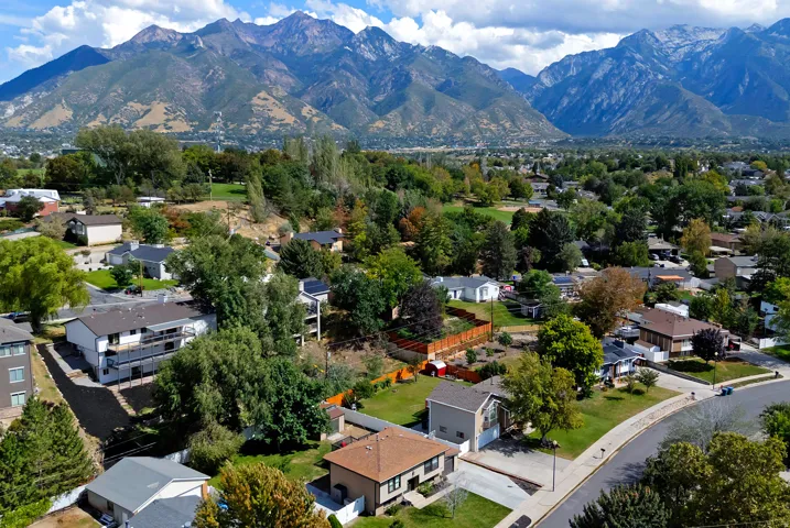 Mountain backdrop, established neighborhood, residential streets, mature trees, single-family homes
