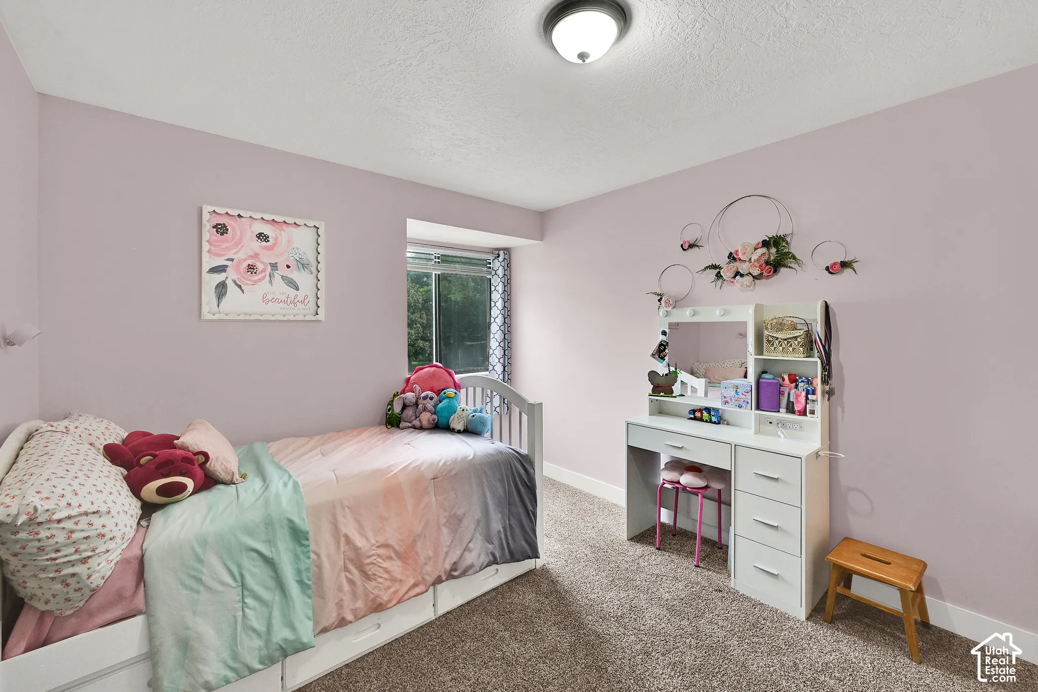 Recessed window with exterior scenery, overhead flush mount light fixture, and carpeted flooring