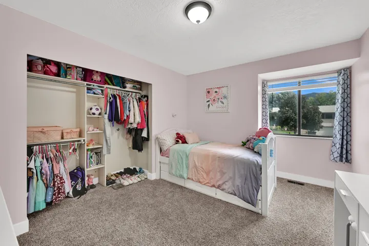 Built-in closet system with open shelving and hanging rods