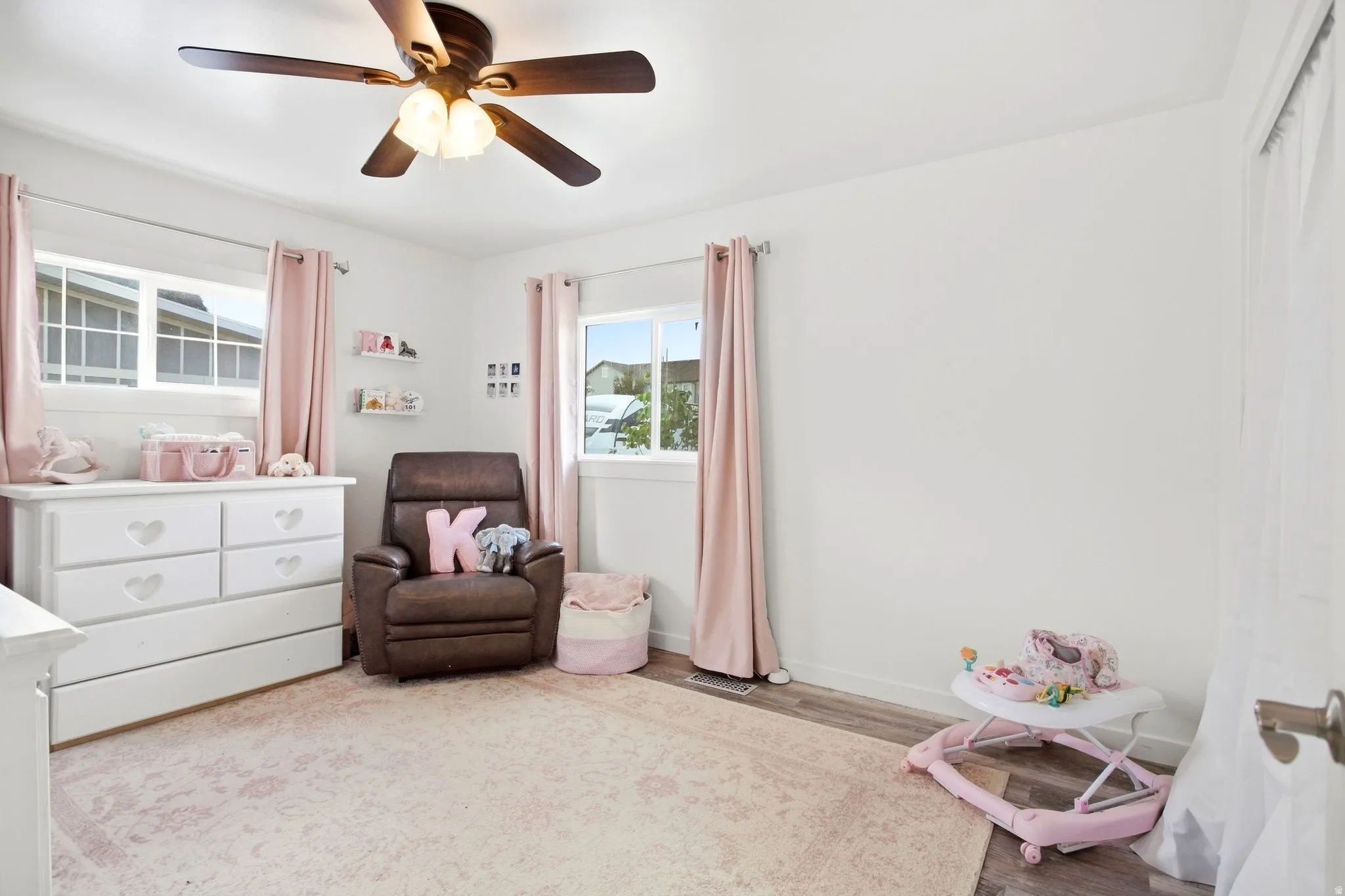 White walls with wood-finish flooring