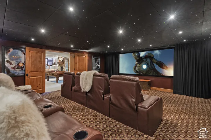 Home theater featuring a large projection screen, recessed lighting, and a starry ceiling