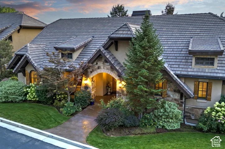 Stone and stucco exterior with a multi-gabled roof
