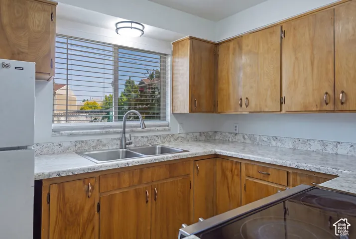 Wood-finish cabinetry paired with light-toned countertops